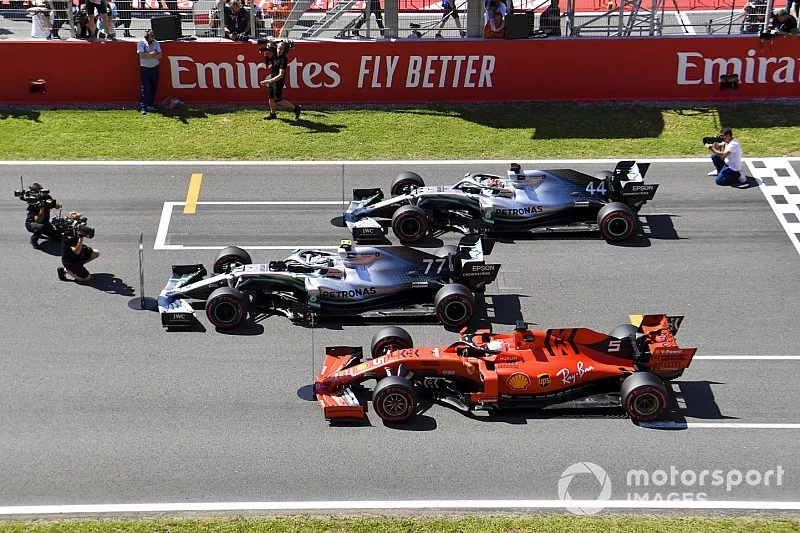Top three Qualifiers Valtteri Bottas, Mercedes AMG W10, Lewis Hamilton, Mercedes AMG F1 W10, and Sebastian Vettel, Ferrari SF90, park on the grid after Qualifying
