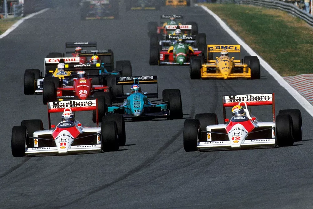 Alain Prost, and team mate Ayrton Senna, McLaren MP4/4 at the start