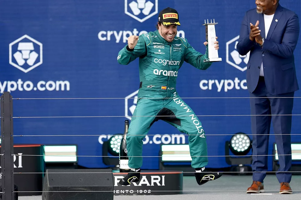 Fernando Alonso, Aston Martin F1 Team, 3rd position, celebrates on the podium with his trophy