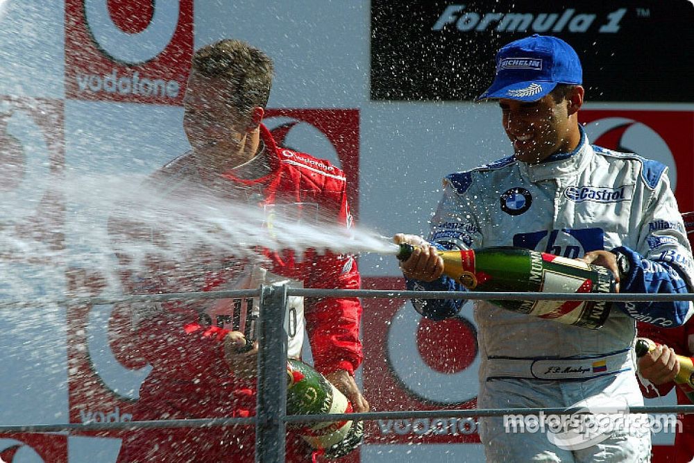 Podium: champagne for Michael Schumacher and Juan Pablo Montoya