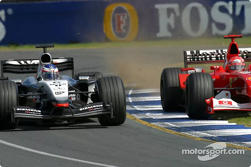Michael Schumacher tries to pass Kimi Raikkonen