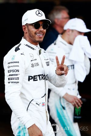 Lewis Hamilton, Mercedes AMG F1, celebrates his pole position in parc ferme, alongside Valtteri Bottas, Mercedes AMG F1