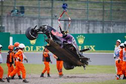 Marshals remove the wreckage in the aftermath of a crash for Daniil Kvyat, Red Bull Racing RB11