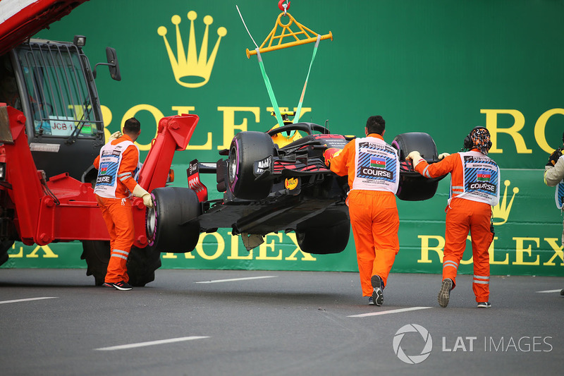 The crashed car of Max Verstappen, Red Bull Racing RB14 is recovered