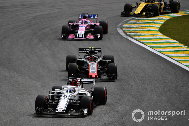 Marcus Ericsson, Sauber C37 leads Kevin Magnussen, Haas F1 Team VF-18 Kevin Magnussen, Haas F1 Team VF-18 and Sergio Perez, Racing Point Force India VJM11 