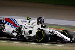 Lance Stroll, Williams FW40, climbs from his crashed car