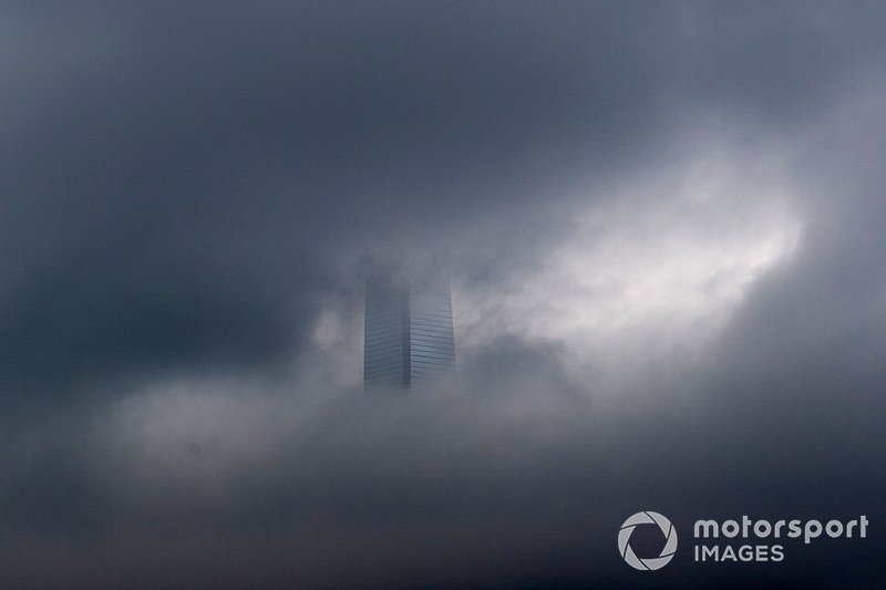 The Hong Kong skyline obscured by rain clouds