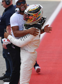 Polesitter Lewis Hamilton, Mercedes AMG F1 celebrates with brother Nicolas Hamilton, in parc ferme