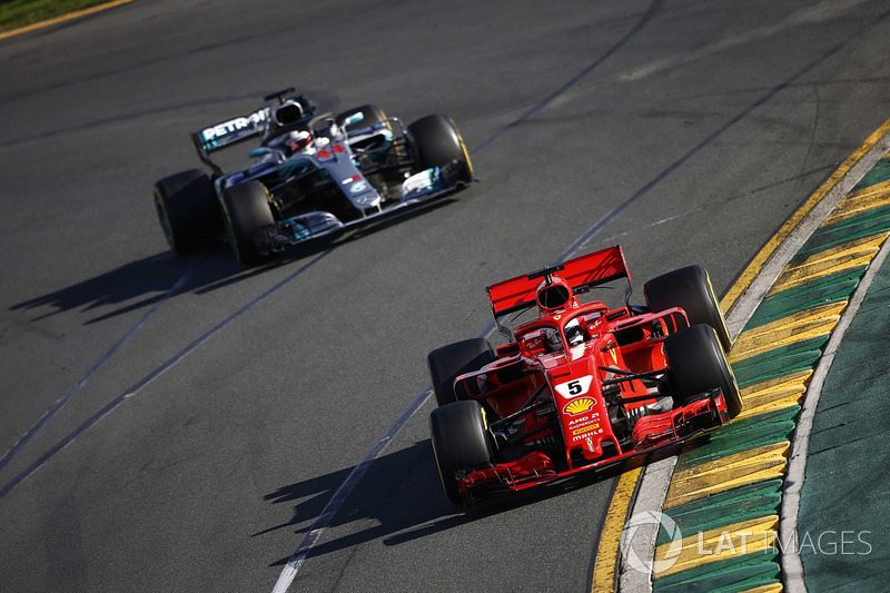 Sebastian Vettel, Ferrari SF71H, leads Lewis Hamilton, Mercedes AMG F1 W09