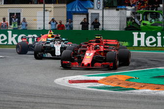 Kimi Raikkonen, Ferrari SF71H, leads Sebastian Vettel, Ferrari SF71H, Lewis Hamilton, Mercedes AMG F1 W09, and Max Verstappen, Red Bull Racing RB14, at the start of the race