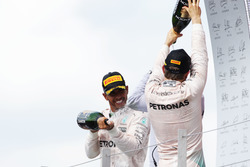 Race winner Lewis Hamilton, Mercedes AMG F1 celebrates on the podium with team mate Nico Rosberg Mer