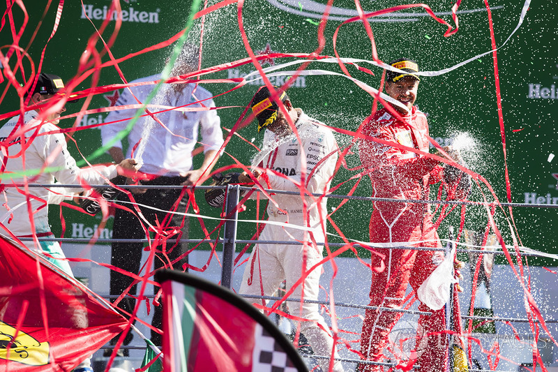 Second place Valtteri Bottas, Mercedes AMG F1, Race winner Third place Lewis Hamilton, Mercedes AMG F1 Sebastian Vettel, Ferrari, celebrate, Champagne on the podium