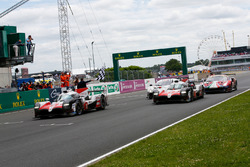 #8 Toyota Gazoo Racing Toyota TS050: Sébastien Buemi, Kazuki Nakajima, Fernando Alonso, crosses the line and takes the chequered flag to win the race ahead of #7 Toyota Gazoo Racing Toyota TS050: Mike Conway, Kamui Kobayashi, Jose Maria Lopez