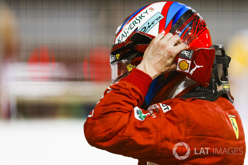 Kimi Raikkonen, Ferrari, takes his helmet off after securing second on the grid in Qualifying