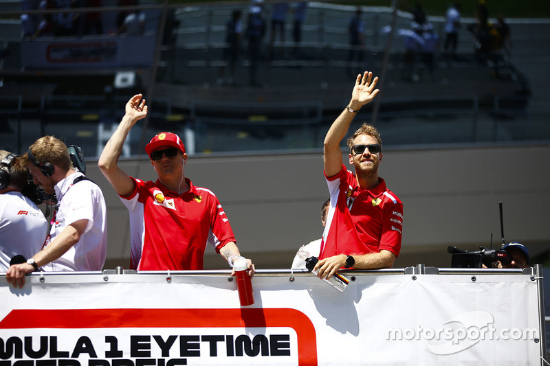 Kimi Raikkonen, Ferrari, and Sebastian Vettel, Ferrari, in the drivers parade