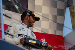 Lewis Hamilton, Mercedes AMG F1 celebrates on the podium with the champagne