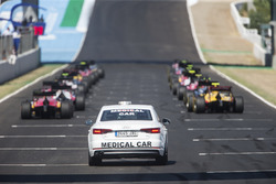 Cars line up on the grid for the start