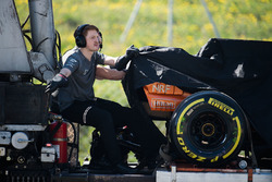 The McLaren MCL32 of Fernando Alonso is recovered back to the pits