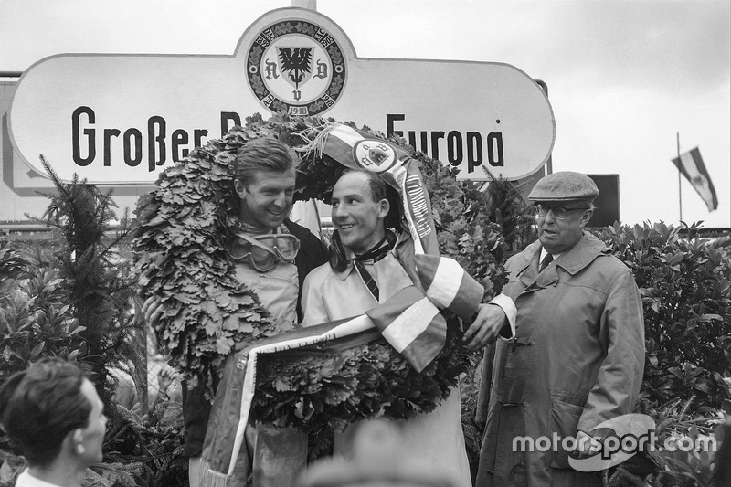 Wolfgang von Trips, and Stirling Moss, celebrate on the podium