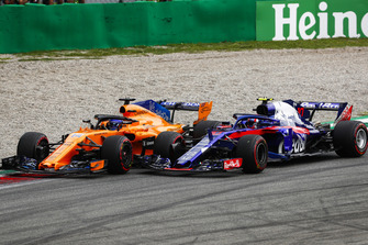 Fernando Alonso, McLaren MCL33, and Pierre Gasly, Toro Rosso STR13, go wheel-to-wheel