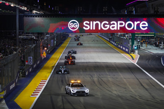 The Safety Car leads Lewis Hamilton, Mercedes AMG F1 W09 EQ Power+, Sebastian Vettel, Ferrari SF71H, Max Verstappen, Red Bull Racing RB14, Valtteri Bottas, Mercedes AMG F1 W09 EQ Power+, and the rest of the field