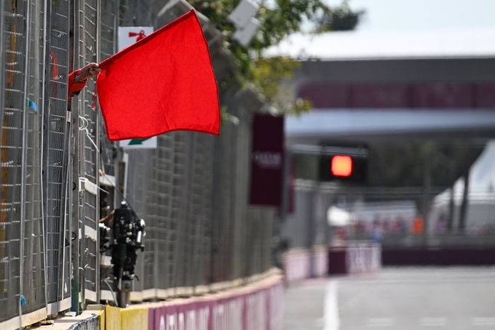 Marshals wave the red flag