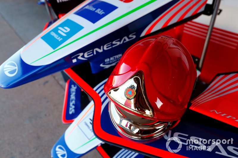 Fireman's helmet on the nose of a Mahindra Racing car