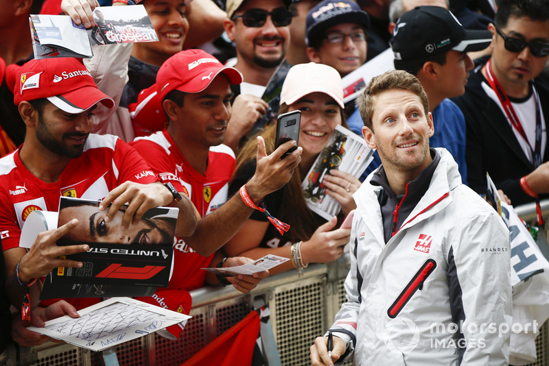 Romain Grosjean, Haas F1 Team, signs autographs for fans