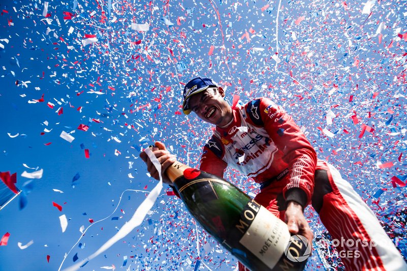 Pascal Wehrlein, Mahindra Racing, celebrates his maiden podium finish on the podium