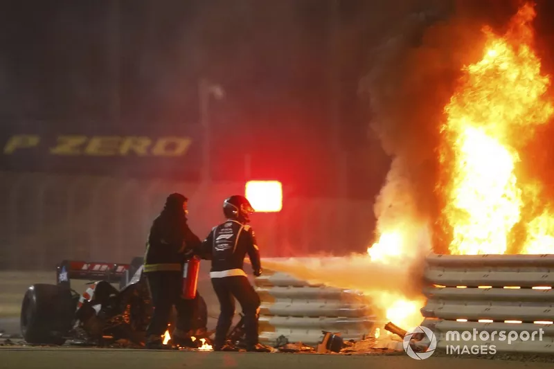 Fire marshals use an extinguisher on a horrific accident of Romain Grosjean, Haas VF-20, on the opening lap of the Bahrain Grand Prix