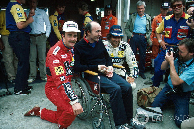 1. Nigel Mansell, Williams, mit Frank Williams, Williams-Teamchef, und Nelson Piquet, Williams