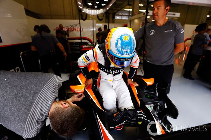 Fernando Alonso, McLaren, settles in to his seat