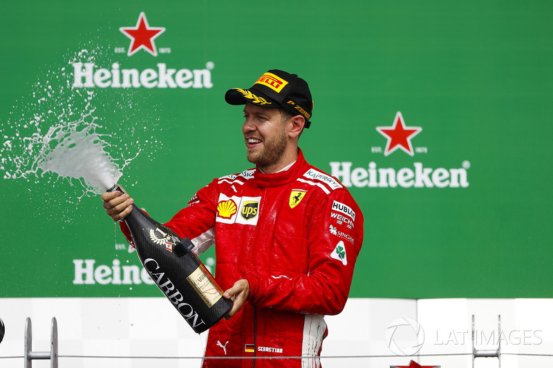 Sebastian Vettel, Ferrari, 1st position, sprays the victory Champagne