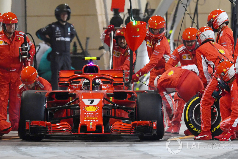 Kimi Raikkonen, Ferrari SF71H hits a mechanic as he leaves the pits