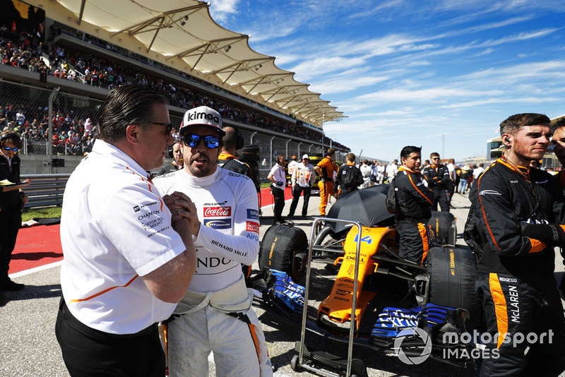 Zak Brown, Executive Director, McLaren Racing, and Fernando Alonso, McLaren, on the grid