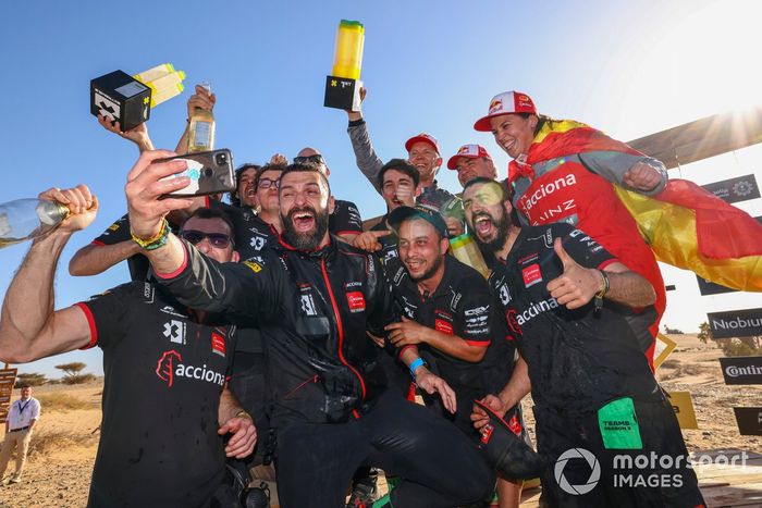 Mattias Ekstrom, Acciona | Sainz XE Team, and Laia Sanz, Sainz XE Team, 1st position, celebrate with their team on the podium