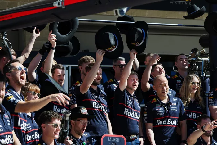 Red Bull Racing Team members pose for a team photo