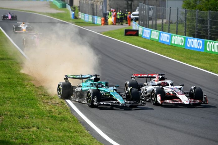 Lance Stroll, Aston Martin Racing, Esteban Ocon, Haas F1 Team