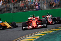 Kimi Raikkonen, Ferrari SF70H, leads Kevin Magnussen, Haas F1 Team VF-17 and Jolyon Palmer, Renault 