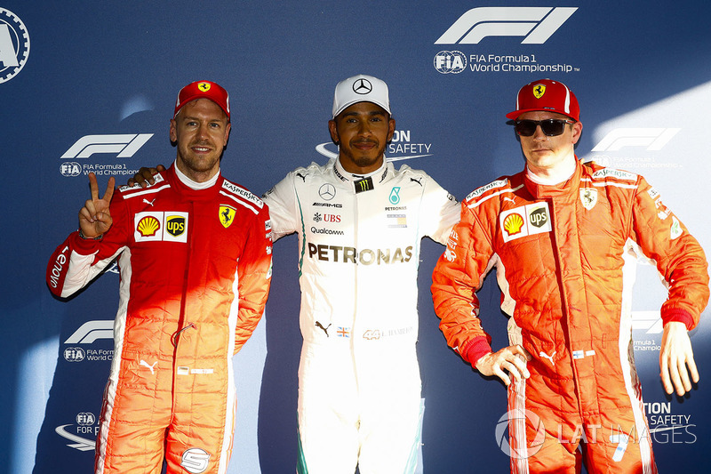 Lewis Hamilton, Mercedes AMG F1, celebrates taking pole position ahead of Sebastian Vettel, Ferrari, and Kimi Raikkonen, Ferrari