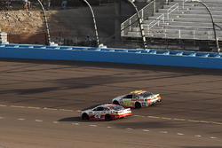 Matt Kenseth, Joe Gibbs Racing Toyota passes Chase Elliott, Hendrick Motorsports Chevrolet for the lead