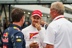 (L to R): Christian Horner, Red Bull Racing Team Principal with Sebastian Vettel, Ferrari and Dr Helmut Marko, Red Bull Motorsport Consultant