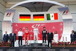 The podium (L to R): Sebastian Vettel, Ferrari, second; Nico Rosberg, Mercedes AMG F1, race winner; Sergio Perez, Sahara Force India F1, third