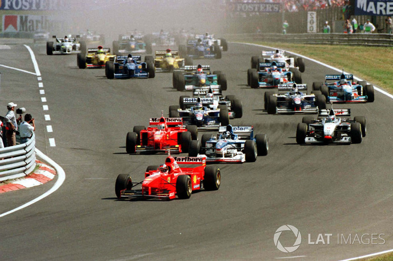 Michael Schumacher leads away the field at the start of the race, just ahead of Damon Hill