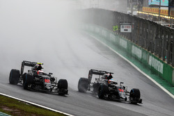 (L to R): Jenson Button, McLaren MP4-31 and team mate Fernando Alonso, McLaren MP4-31 battle for pos