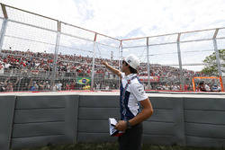 Lance Stroll, Williams, throws hats to fans