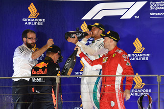Max Verstappen, Red Bull Racing, Lewis Hamilton, Mercedes AMG F1 and Sebastian Vettel, Ferrari celebrate on the podium with the champagne