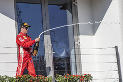 Kimi Raikkonen, Ferrari celebrates on the podium with the champagne