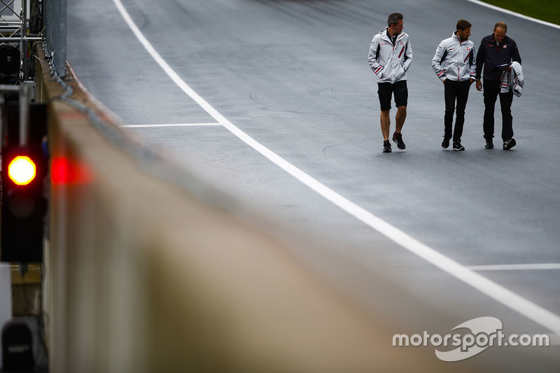 Romain Grosjean, Haas F1 Team, conducts a track walk with colleagues