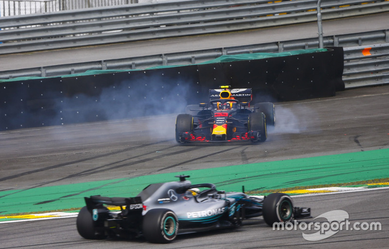 Lewis Hamilton, Mercedes AMG F1 W09, passes a spinning Max Verstappen, Red Bull Racing RB14 Tag Heuer, after the latter suffers a collision with Esteban Ocon, Force India VJM11 Mercedes. 